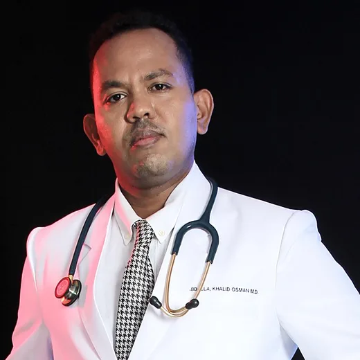 Dr Khalid Seidi in a white coat with a stethoscope